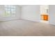Bright bedroom with large window and an adjacent bathroom at 11969 E Lake Cir, Greenwood Village, CO 80111