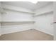 Walk-in closet with shelving and carpeted floor at 11969 E Lake Cir, Greenwood Village, CO 80111