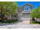 Two-story home with a well-manicured lawn and a two-car garage at 11969 E Lake Cir, Greenwood Village, CO 80111