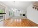 Bright living room featuring a fireplace, large windows, and hardwood floors at 11969 E Lake Cir, Greenwood Village, CO 80111