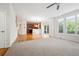 Open floor plan with a combined living room, kitchen, and dining area at 11969 E Lake Cir, Greenwood Village, CO 80111