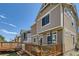 Back exterior showing wooden deck offering a great space for entertaining, enhanced by views of neighboring properties at 4405 Walden Ct, Denver, CO 80249