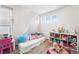 Charming bedroom showcases colorful decor, soft rugs, and plenty of room for play at 4405 Walden Ct, Denver, CO 80249