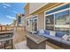 Outdoor deck featuring comfortable seating, a fire pit, and a grill, perfect for relaxation and entertaining at 4405 Walden Ct, Denver, CO 80249