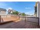 Spacious wooden deck overlooking the backyard with neighboring houses at 4405 Walden Ct, Denver, CO 80249