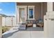 Cozy covered porch with wicker chairs, perfect for enjoying a morning coffee or relaxing in the evening at 4405 Walden Ct, Denver, CO 80249