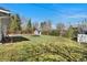 Expansive backyard featuring a lush lawn, garden, and wooden privacy fence at 3002 S Fenton St, Denver, CO 80227