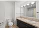 The bathroom features a double sink and vanity, along with a tiled floor at 3002 S Fenton St, Denver, CO 80227