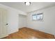 This bedroom features hardwood floors, a closet, and a window with ample light at 3002 S Fenton St, Denver, CO 80227