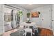 Cozy dining area is perfect for gatherings and features sliding glass doors and modern decor at 3002 S Fenton St, Denver, CO 80227