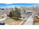 Aerial view of a ranch-style home with mature landscaping and a detached garage at 1720 Mable Ave, Denver, CO 80229