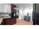 This open kitchen features granite countertops and stainless steel appliances at 1720 Mable Ave, Denver, CO 80229