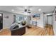 Inviting living room features hardwood floors, recessed lighting, and a cozy seating area at 1720 Mable Ave, Denver, CO 80229