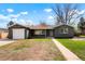 Charming single story home with a freshly painted gray exterior and a well-manicured lawn at 4320 Lamar St, Wheat Ridge, CO 80033