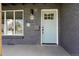 Charming front door with glass panes, a black mailbox, and the house number displayed above at 4320 Lamar St, Wheat Ridge, CO 80033
