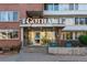 Apartment building entrance featuring the building name 'Gotham' above glass doors at 1196 N Grant St # 405, Denver, CO 80203