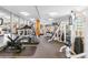 Well-equipped fitness center with various machines and large windows at 1196 N Grant St # 405, Denver, CO 80203