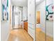 Hallway featuring built-in storage and mirrored sliding closet door at 1196 N Grant St # 405, Denver, CO 80203