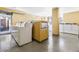 Laundry room with several washing machines at 1196 N Grant St # 405, Denver, CO 80203
