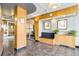 Lobby area with tiled floors, seating, plants, and decorative wall art at 1196 N Grant St # 405, Denver, CO 80203