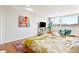 Cozy bedroom featuring bright windows, contemporary furniture, and a colorful area rug at 1196 N Grant St # 405, Denver, CO 80203