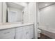 Bright bathroom showcasing a double vanity with quartz countertops, a large mirror, and a shower/tub at 2177 Flower Blossom Ave, Brighton, CO 80601