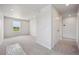 Bright bedroom featuring plush carpeting, a window with scenic views, and ample natural light at 2177 Flower Blossom Ave, Brighton, CO 80601