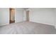 Bedroom with neutral carpet, white walls, and doorway views at 2177 Flower Blossom Ave, Brighton, CO 80601