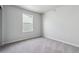 Bedroom has neutral carpeting and a single window with blinds at 2177 Flower Blossom Ave, Brighton, CO 80601