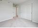 Spacious bedroom featuring carpet, white walls, closet with bi-fold doors at 2177 Flower Blossom Ave, Brighton, CO 80601