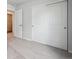 Carpeted bedroom with view of closet doors at 2177 Flower Blossom Ave, Brighton, CO 80601