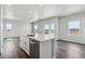 Contemporary kitchen with sleek island, stainless steel appliances, and ample counter space at 2177 Flower Blossom Ave, Brighton, CO 80601