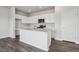 Modern kitchen featuring white cabinets, stainless steel appliances, and center island perfect for entertaining at 2177 Flower Blossom Ave, Brighton, CO 80601