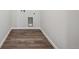 A laundry room featuring wood plank floors at 2177 Flower Blossom Ave, Brighton, CO 80601