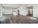 Spacious living area boasts an open-concept design, seamlessly connecting living, dining, and kitchen spaces at 2177 Flower Blossom Ave, Brighton, CO 80601