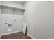 Bright storage room features a white wall shelf and modern wood-look vinyl flooring at 2177 Flower Blossom Ave, Brighton, CO 80601