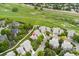 Residential neighborhood features homes near a golf course with walking trails, mature trees, and streets at 9441 Southern Hills Cir, Lone Tree, CO 80124