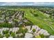 Overhead view of a neighborhood nestled in a picturesque landscape with a golf course and trees at 9441 Southern Hills Cir, Lone Tree, CO 80124