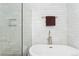 Modern bathroom featuring a standalone tub, glass shower, and sleek fixtures at 9441 Southern Hills Cir, Lone Tree, CO 80124