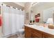 Bright bathroom with shower, vanity, and mirror at 9441 Southern Hills Cir, Lone Tree, CO 80124