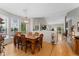 Bright dining room featuring hardwood floors and ample natural light from large windows at 9441 Southern Hills Cir, Lone Tree, CO 80124