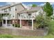 Attractive condo with brick accents, private patios, and lush landscaping on a sunny day at 9441 Southern Hills Cir, Lone Tree, CO 80124
