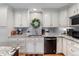 Well-appointed kitchen with granite counters and white cabinets at 9441 Southern Hills Cir, Lone Tree, CO 80124