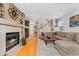 Spacious living room with fireplace and wooden floors at 9441 Southern Hills Cir, Lone Tree, CO 80124