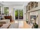 Bright living room with fireplace and sliding door to outdoor seating at 9441 Southern Hills Cir, Lone Tree, CO 80124