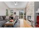 Comfortable living area featuring a stone fireplace and hardwood flooring at 9441 Southern Hills Cir, Lone Tree, CO 80124