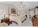 Large main bedroom featuring a four-poster bed, ample space, and walk-in closet access at 9441 Southern Hills Cir, Lone Tree, CO 80124