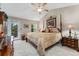 Spacious main bedroom with four-poster bed, balcony access, and vaulted ceiling at 9441 Southern Hills Cir, Lone Tree, CO 80124