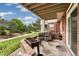 Outdoor patio with relaxing seating area overlooking green space at 9441 Southern Hills Cir, Lone Tree, CO 80124
