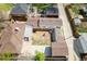Aerial view of the property featuring backyard space, wood burning stove, garage, and neighboring homes at 3021 Grape St, Denver, CO 80207